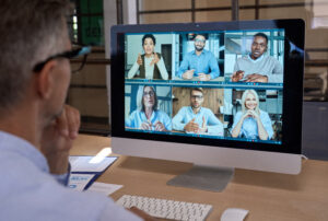 user on laptop conference meeting